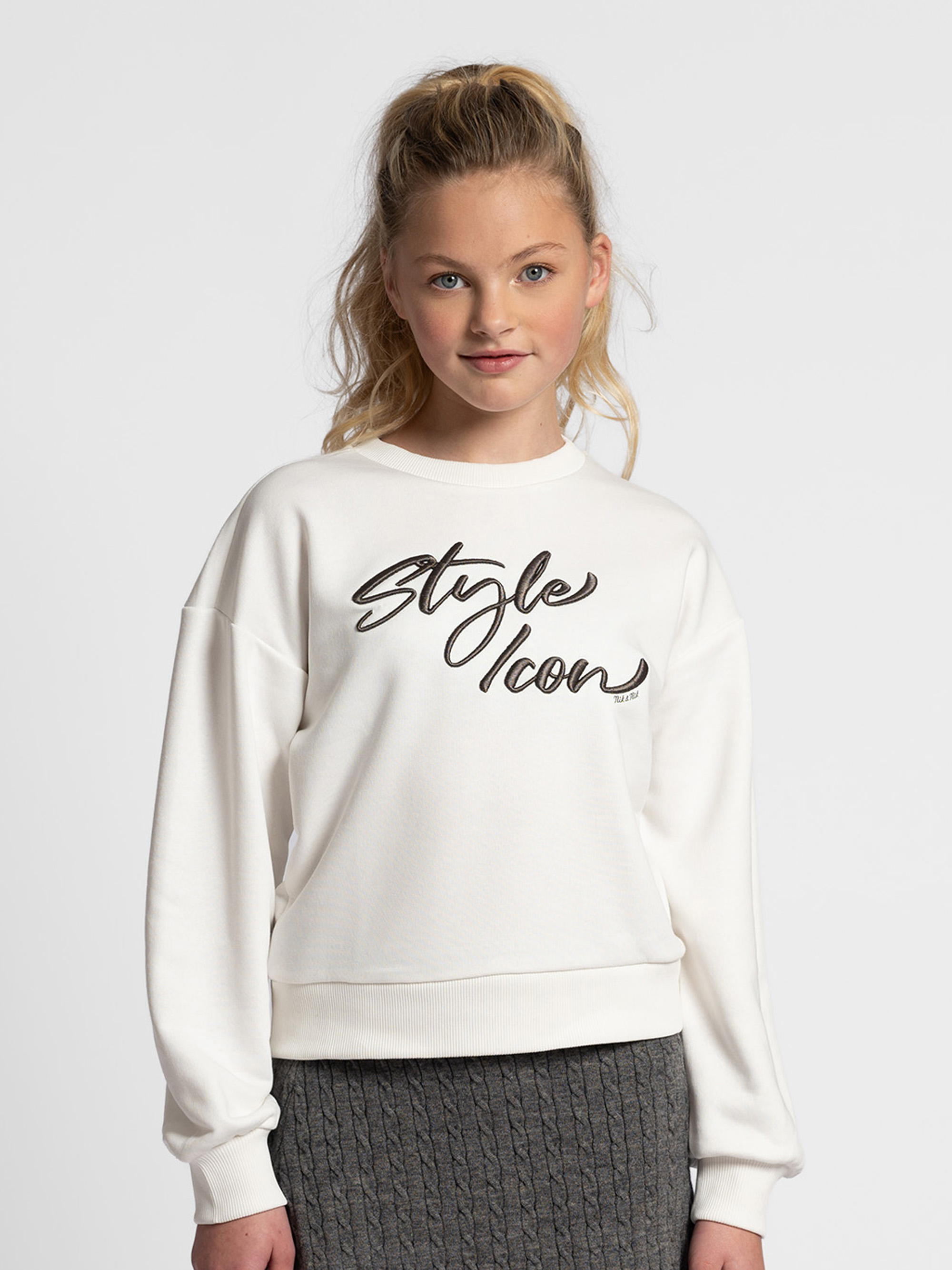 Sweater with embroidered text